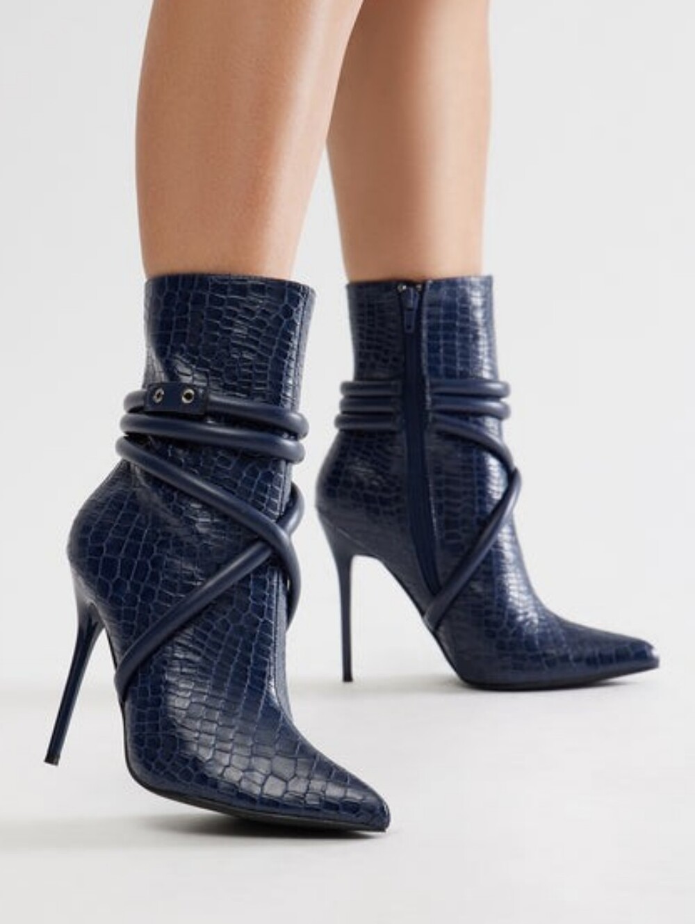 Elegant women's ankle boots with high stiletto heels, which have an original